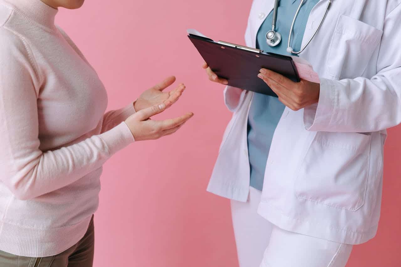 Patient speaking with a GP about contraception during a family planning consultation